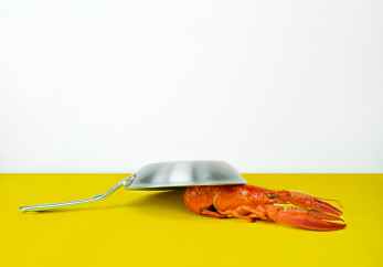 gray steel cooking pan near orange lobster